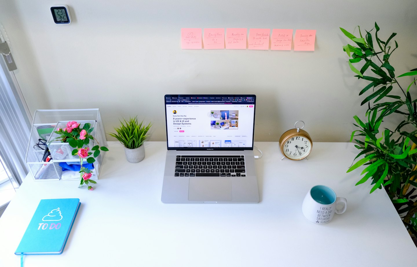 Laptop and office supplies on a tidy modern desk.